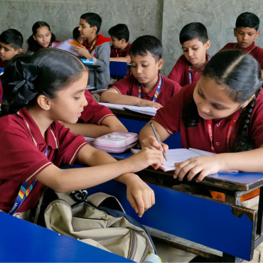 Royal Academy Primary School students engaged in interactive learning